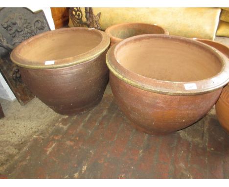 Pair of large stoneware brown glazed garden planters, 24ins diameter x 22ins high 