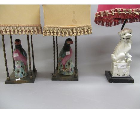 Pair of table lamps in the form of porcelain figures of birds in decorative gilt brass cage form stands with shades, 17ins hi