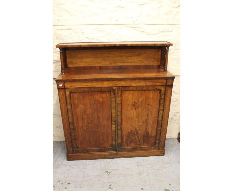 Victorian rosewood chiffonier with a low shelf back above a pair of rectangular panelled doors on a plinth base, 3ft 8ins wid