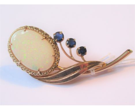 1960's Gold floral spray brooch set large oval opal and three sapphires, 11g, 64mm wide, the opal 24mm x 16mm 