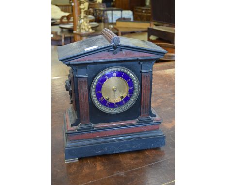 19th Century black slate and red marble mantel clock, the circular dial having blue enamel chapter ring with Roman numerals a