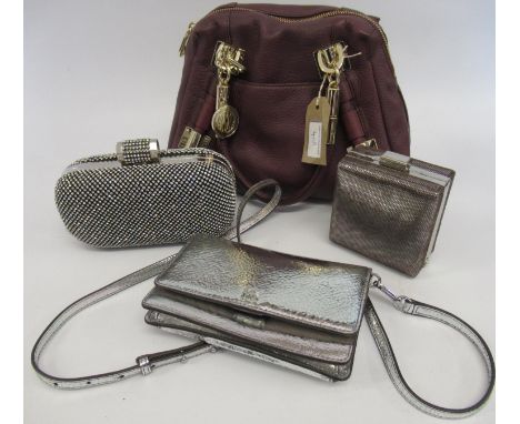 DKNY burgundy leather handbag with gold tone hardware, together with a Michael Kors silver leather clutch purse with detachab