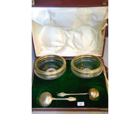 Buenos Aires cased white metal mounted and cut glass pair of fruit serving bowls, with a shell form ladle and another ladle, 