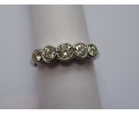 Platinum ring set five graduated brilliant cut diamonds 