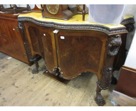 Early 20th Century figured walnut commode in George II style, the painted faux marble top above a carved moulding and two ser