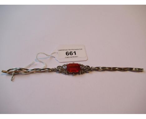 Edwardian large fire opal and diamond set bracelet of pierced design, the opal approximately 15mm x 10mm, 13.2g 