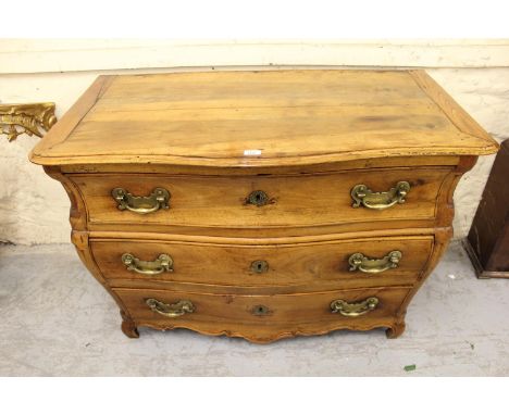 Antique Continental fruitwood bombe shaped commode chest, the moulded top above three long drawers with heavy brass handles r