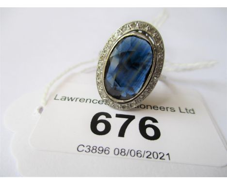 French platinum oval sapphire and diamond ring, circa 1920, the sapphire approximately 14mm x 10mm, 5.1g 