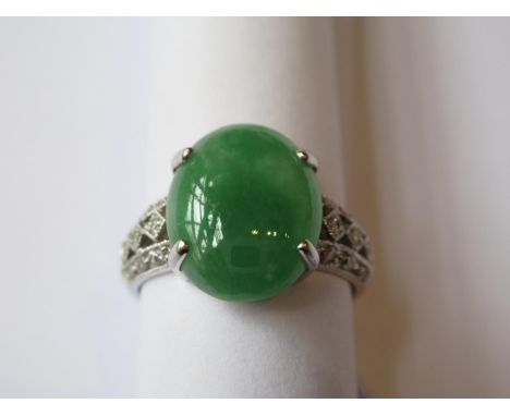 18ct White gold oval jade set ring with diamond set shouldersJade is 13mm x 10mm and in good overall condition.It has an Engl