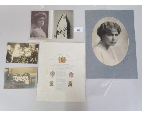 Large head and shoulder portrait photograph of Queen Marie of Romania in an oval mount with photographer's signature ' Juliet