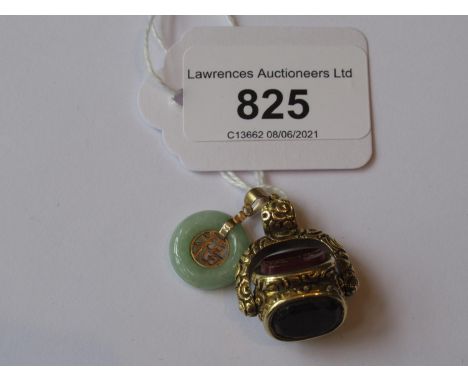 Yellow metal triple revolving fob together with a small Chinese 9ct gold mounted jade pendant 