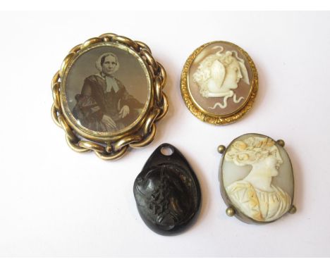 Victorian pinchbeck set cameo brooch carved in deep relief in the form of a classical female head, 45mm x 40mm overall (pin l