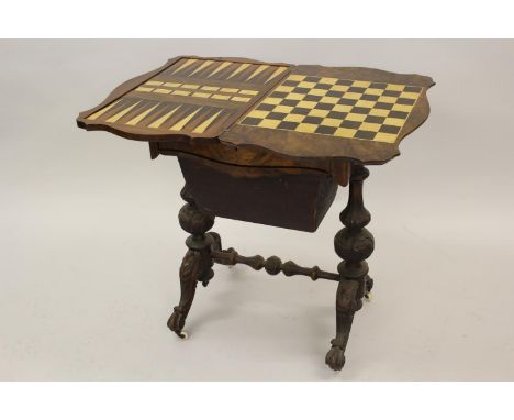 Victorian figured walnut games / work table, the shaped fold-over swivel top enclosing chess, backgammon and cribbage board, 