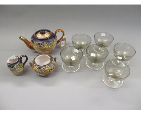 Royal Doulton stoneware three piece tea service with floral relief moulded decoration, together with a set of six clouded gla