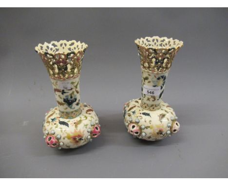 Pair of Zsolnay flared rim baluster form vases with floral decoration and pierced rims, 8.5ins highSmall chip to one, otherwi