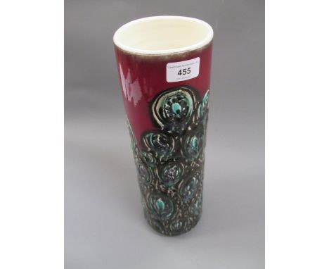 Mid 20th Century Poole pottery vase of cylindrical tapering form with stylised decoration on a red ground, 15.75ins high 