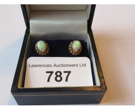 Pair of oval 9ct gold and opal ear studs 