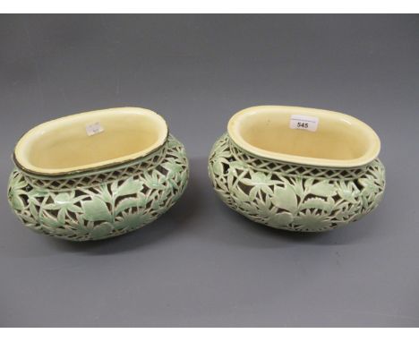 Pair of Zsolnay ovoid green glazed floral and foliate reticulated jardinieres, 60ins high, 9ins wide, 6.5ins deepOne has a pa
