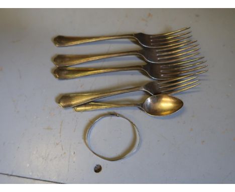 Small quantity of silver flatware and a childrens white metal bangle 