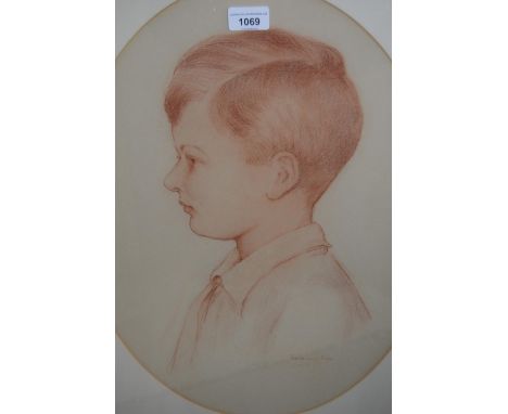 Harold Cox, sanguin drawing, portrait of a boy in profile, oval mounted, 19.5ins x 14.5ins together with another of a young m