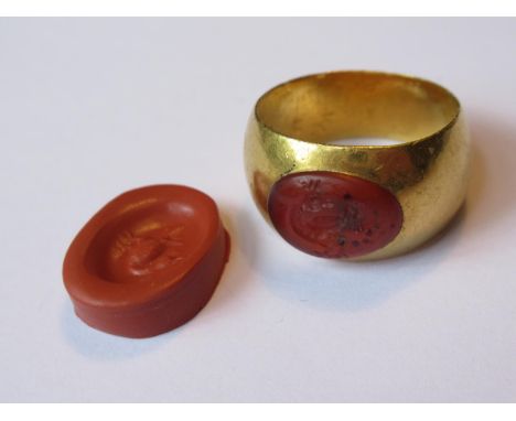 Western Asiatic Sassanian high carat gold intaglio inset seal ring, together with a wax casting of the seal, 16.5g 