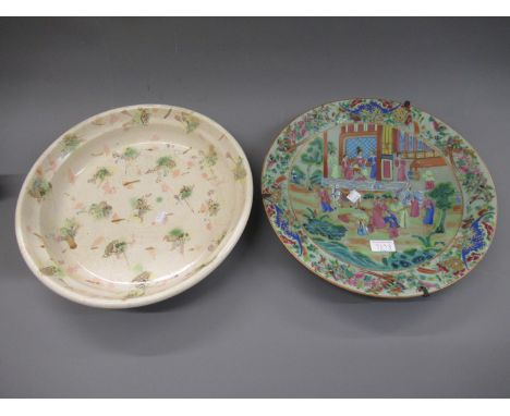 Chinese circular wall plate painted with figures on a terrace and in a garden within a floral and bird painted border, 14.5in