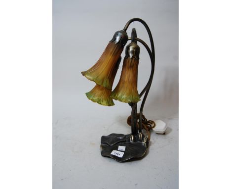 Reproduction Art Nouveau patinated metal and glass three light table lamp of floral design 