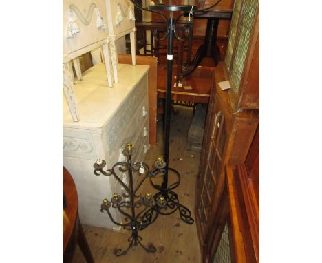 Wrought iron hat, coat and umbrella stand together with a seven light floor standing candelabra 