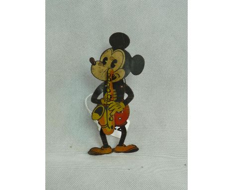 A rare German lithograph tin plate toy of Mickey Mouse, playing a saxophone and symbols, printed Ideal Films Ltd copyright ma