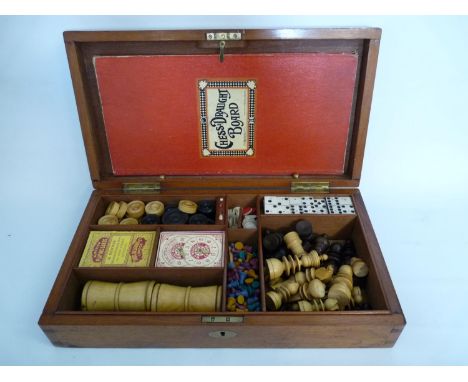 Edwardian Walnut cased Games compendium including De La Rue Playing cards, Bone Dominoes etc 