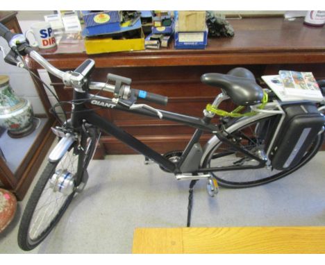 A Giant Twist Express RS2 Hybrid electric bicycle with battery pack, keys and owner's manual 