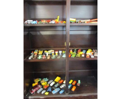 A collection of vintage vehicles to include Dinky, a Batmobile &amp; petrol pumps 
