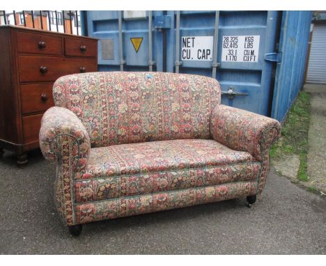 A two seater upholstered sofa circa 1920 