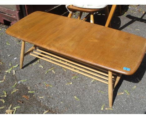 A light Ercol two tier coffee table 14 1/2"h x 41"w 