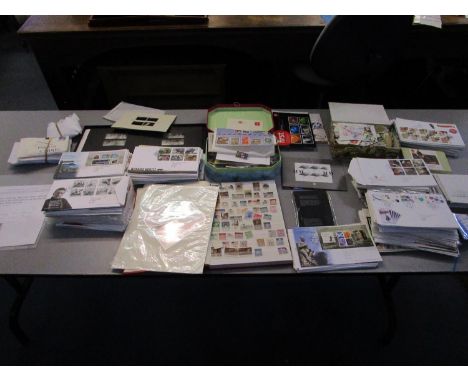 A collection of stamps from around the world, First Day covers and collectors stamps to include a stamp album, a United State