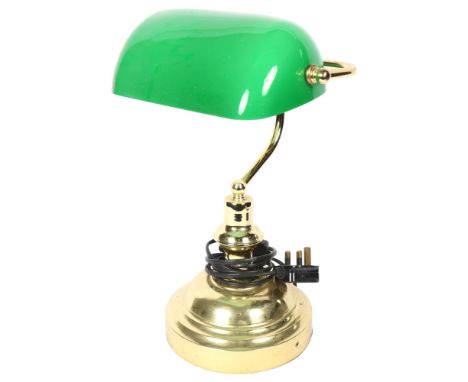 An adjustable brass desk lamp, with green glass shade, height 38cm 
