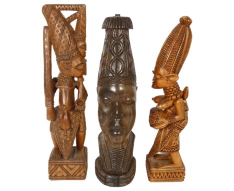 An African carved Benin head hardwood lamp base, height 40cm, and a pair of carved wood figures, signed Ganl Fakeye 