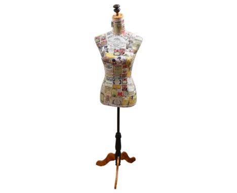 Clive Fredriksson, a decoupage decorated half-size mannequin of the female form, on pine tripod stand, height 149cm 
