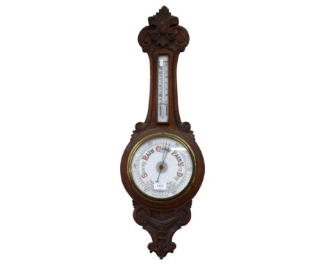 A Victorian carved oak-framed aneroid barometer, length 90cm 