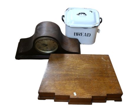 A Napoleon hat clock (glass cracked), an Art Deco oak canteen box and contents, and an enamel bread bin 