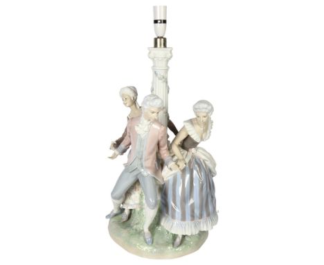 A large Lladro porcelain table lamp supported by 3 figures in Period costume, on plinth (A/F), height overall 63cm 