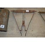 Farm-made T-bar and drop arms.