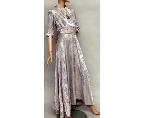 A 1940s grey embossed full length satin dress by 'Aliaga' of Brompton Road. The dress features three-quarter length sleeves w