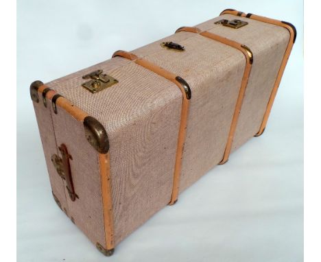 A large wood strapped trunk with leather handles and brass fittings. NIce clean condition. 35"L x 19"W x 11"D.