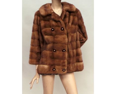 A 1960s lined mink jacket and stole. Jacket hooks to fasten and has a double-breasted button detail. The stole has a dual pur