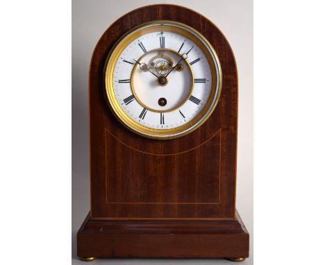 A Francois Frere mantel clock, late 19th century, in an arched walnut case inlaid with boxwood stringing, the enamel face wit