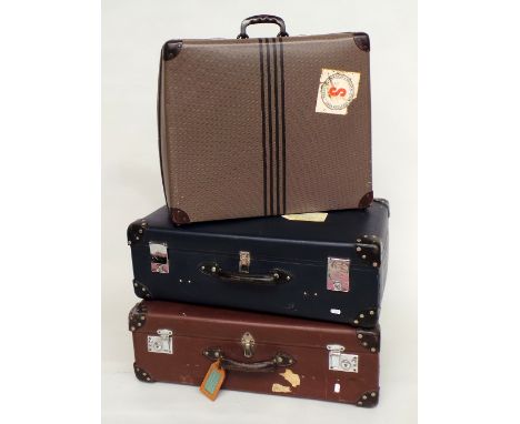 Three vintage suitcases all circa 1950s. A blue and a brown  'Globetrotter' case - both same size  28"L x 16"W x 9"D and a sm