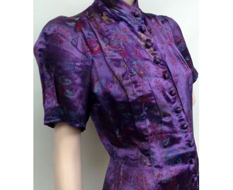 A vintage purple Chinese short sleeved blouse with mandarin collar and covered buttons. Garment looks to be home-made probabl