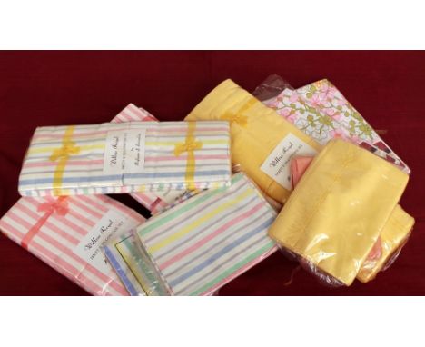 A quantity of vintage 60s/70s sheets and bed linen all still in original packaging. At least twenty pieces. (Qty)