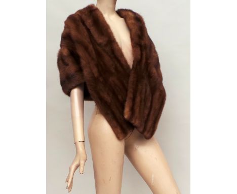 Two vintage 'Harrods' furs. A pale brown mink stole with a shawled collar and gathering of the pelts dropping from the should